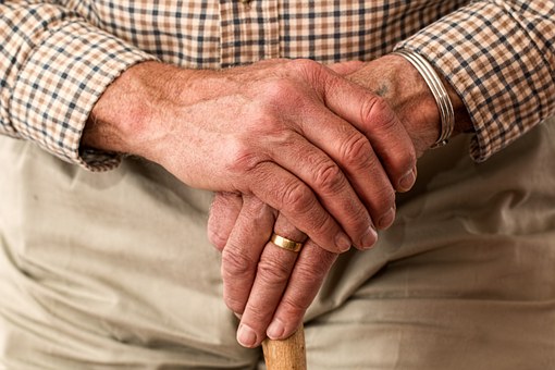 hands elderly man helping elderly relatives around the house 